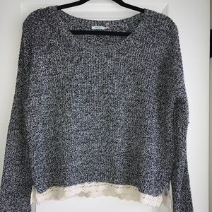 Grey and white short sweater with lace bottom.